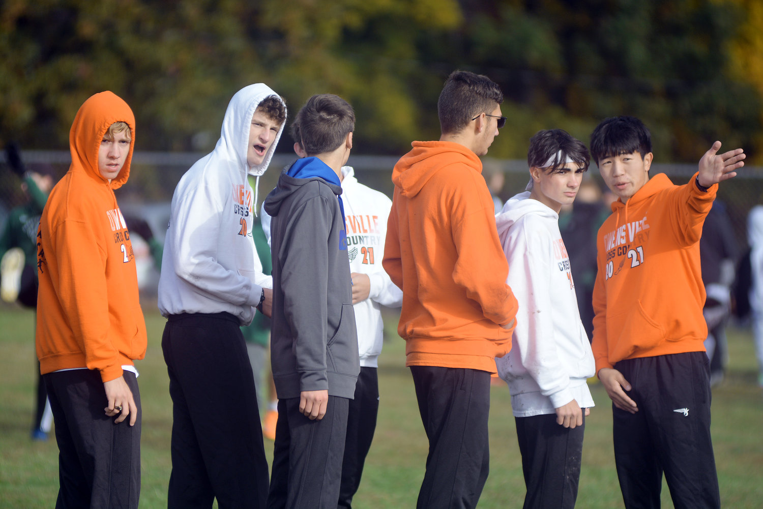 Freddy Zheng (far right) gives a few pointers about the course at the Osage County Fairgrounds during the MSHSAA Class 3, District 3 Cross Country meet held Saturday in Linn.